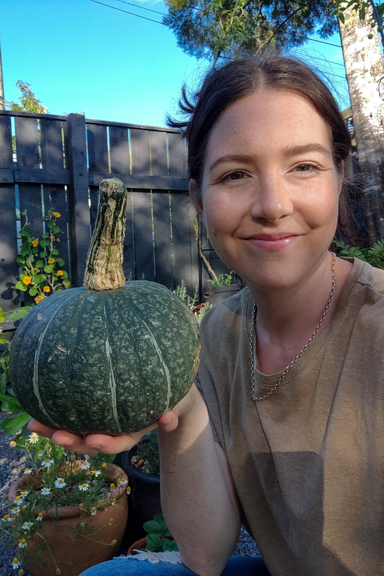 Elly harvesting pumpkin_