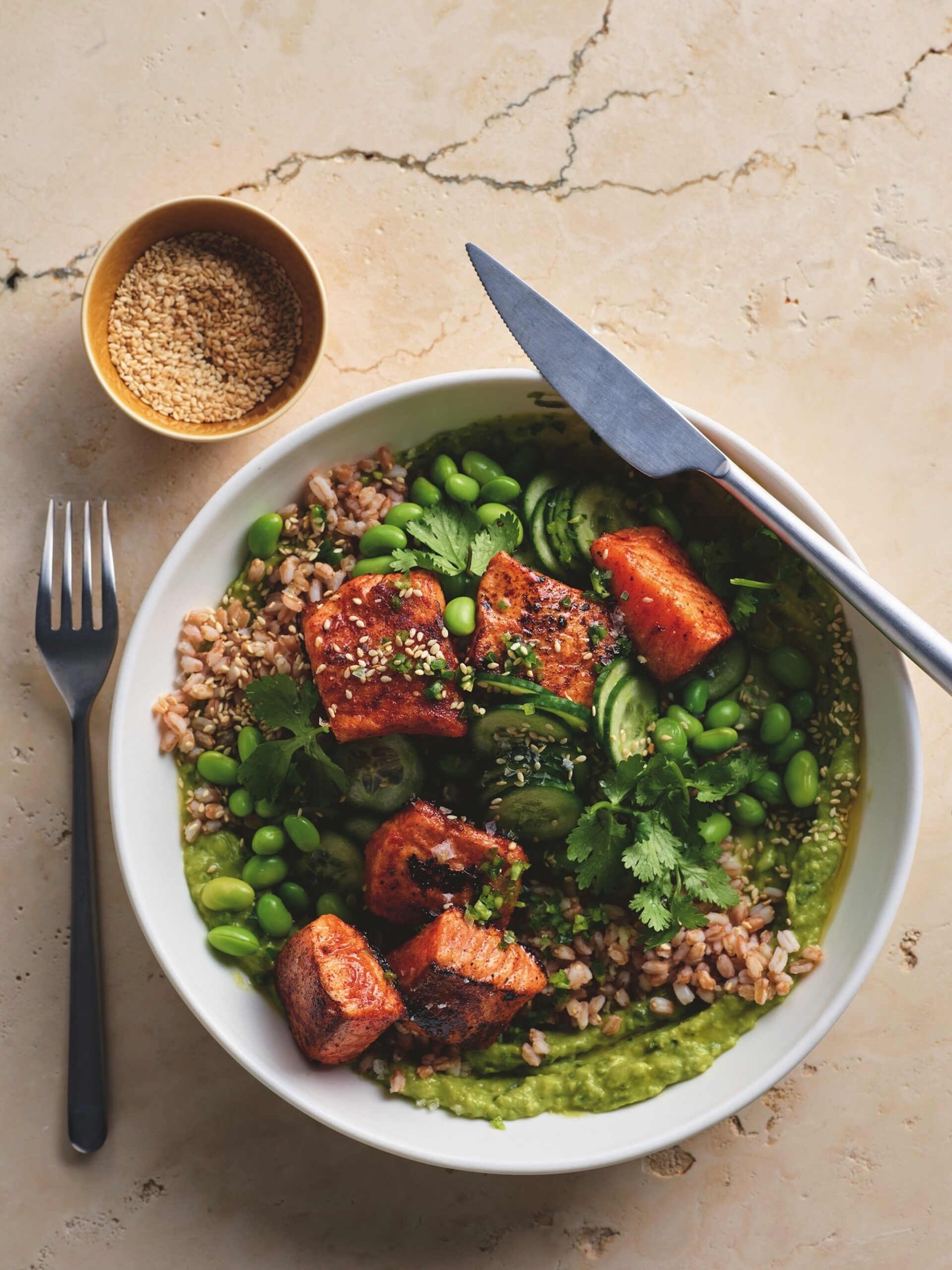 Spiced salmon with edamame and creamy avocado sauce