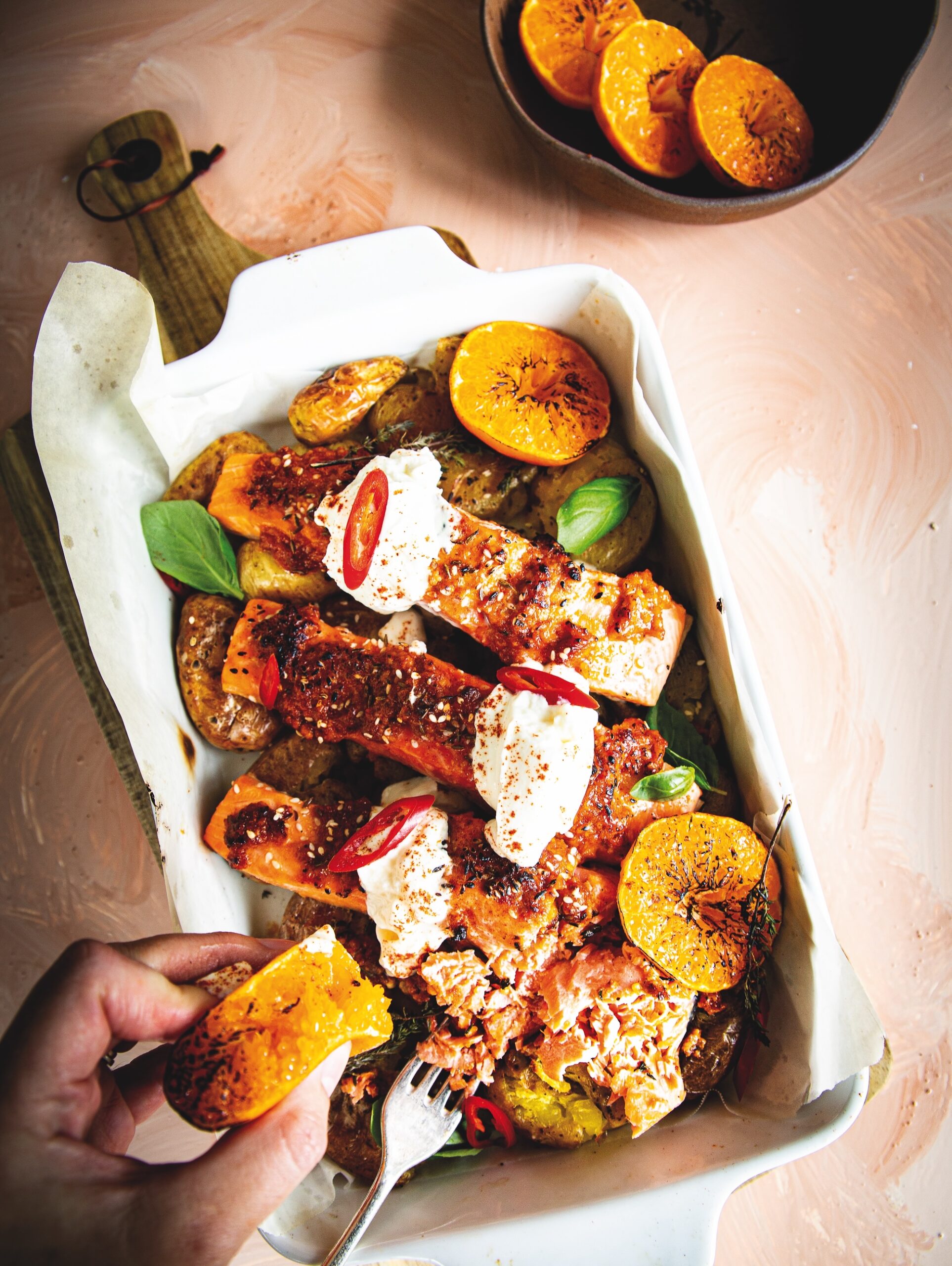 One-pan salmon with smashed potatoes, romesco & satsumas