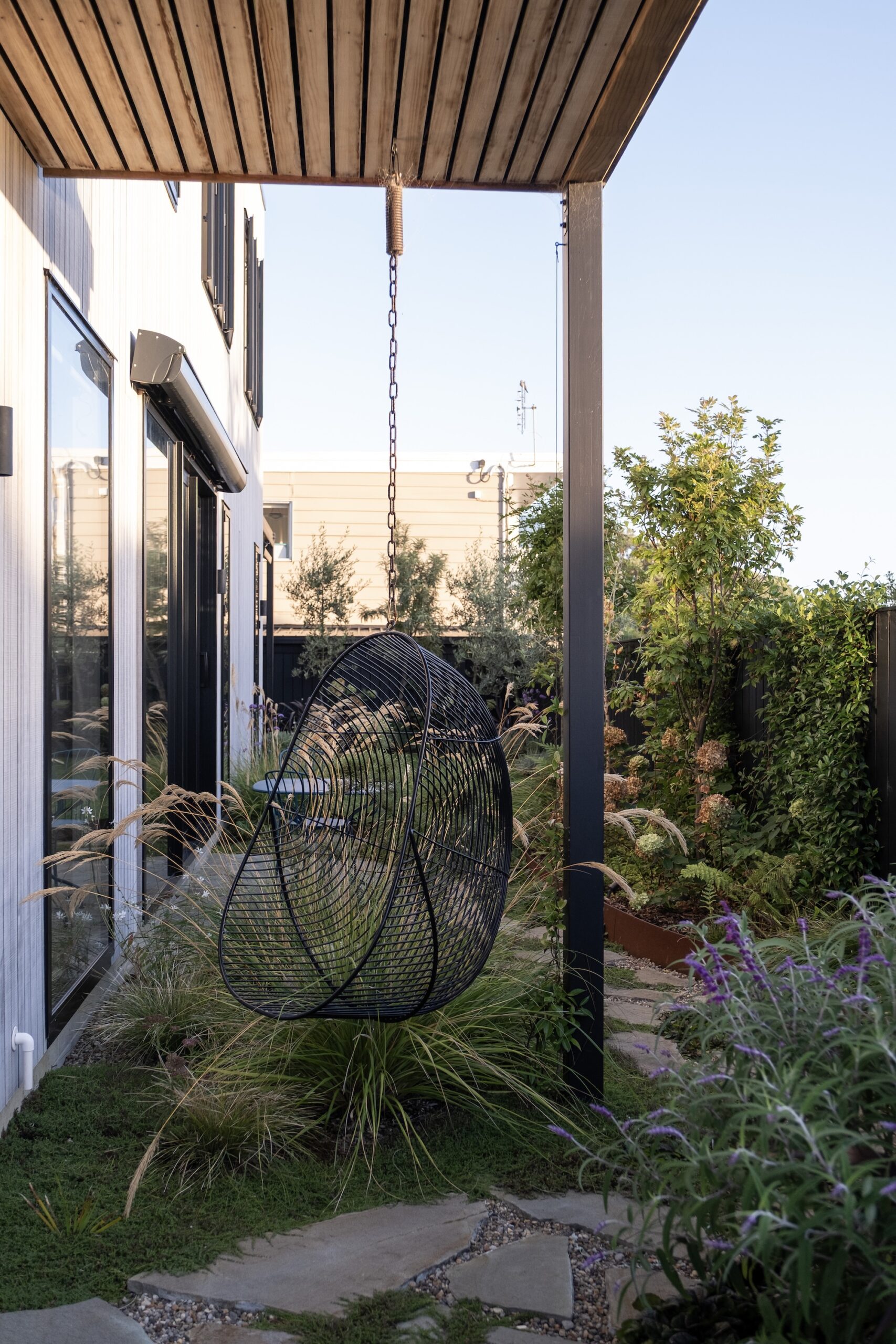 Architectural corner with ornamental grasses and structural planting