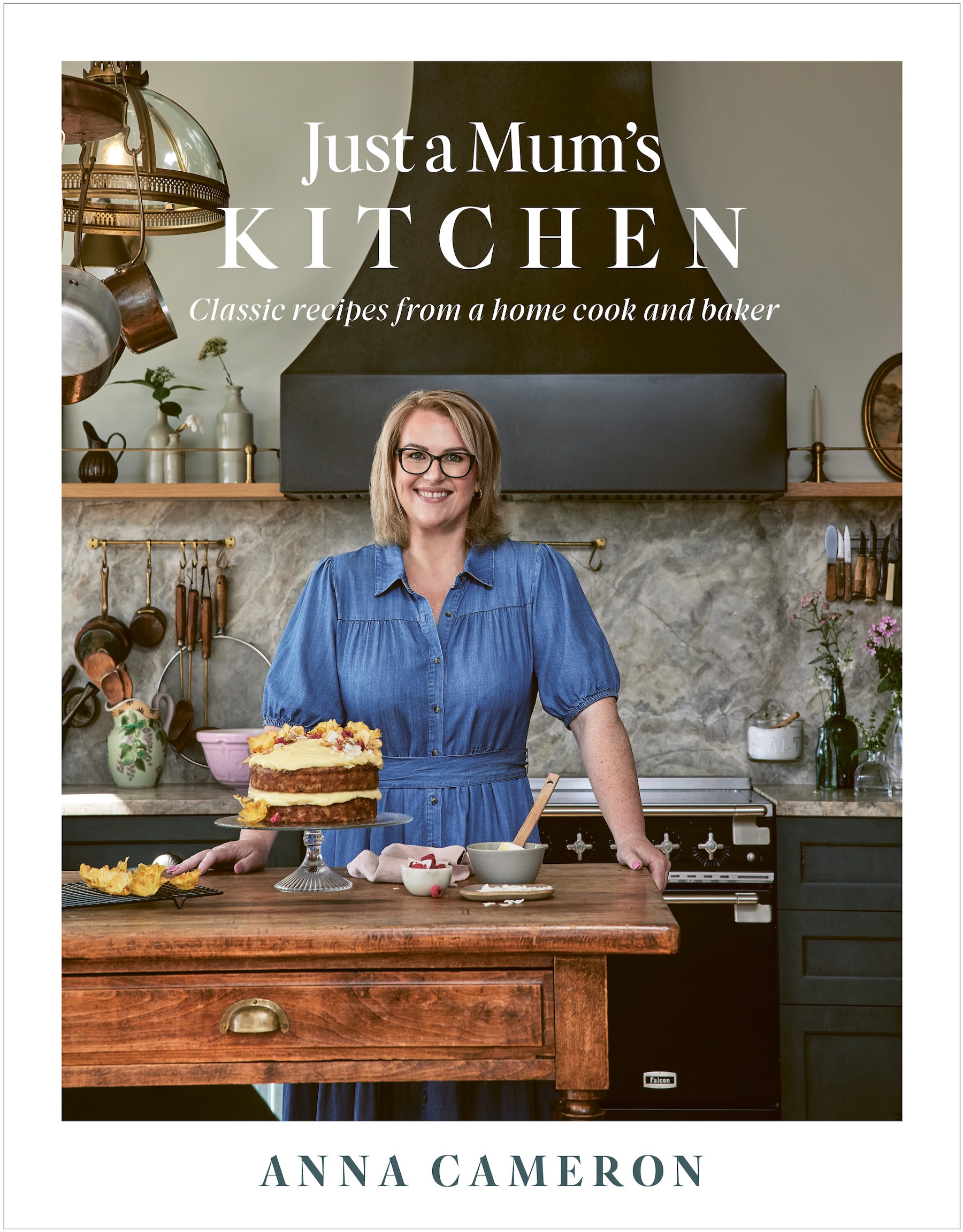 Just a Mum's KITCHEN recipe book Just a Mum’s Kitchen cookbook cover featuring author in a cosy home kitchen with a layered sponge cake and baking ingredients