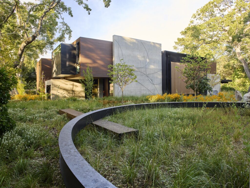 Circular bench framing a native wildflower meadow