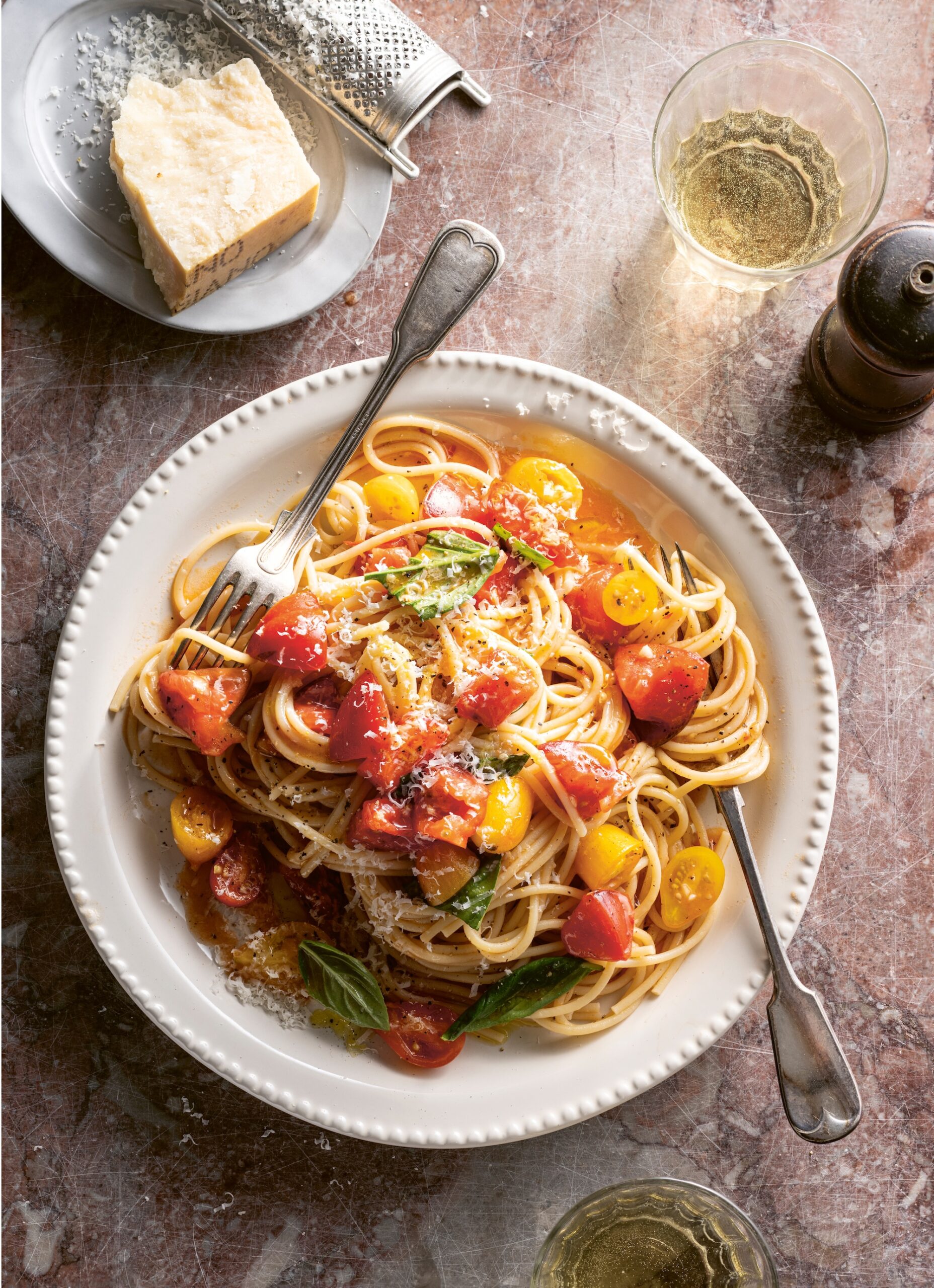 White plate with pasta and fresh red tomato sauce from Jane & Jimmy Barnes recipe book ‘Seasons Where the River Bends’