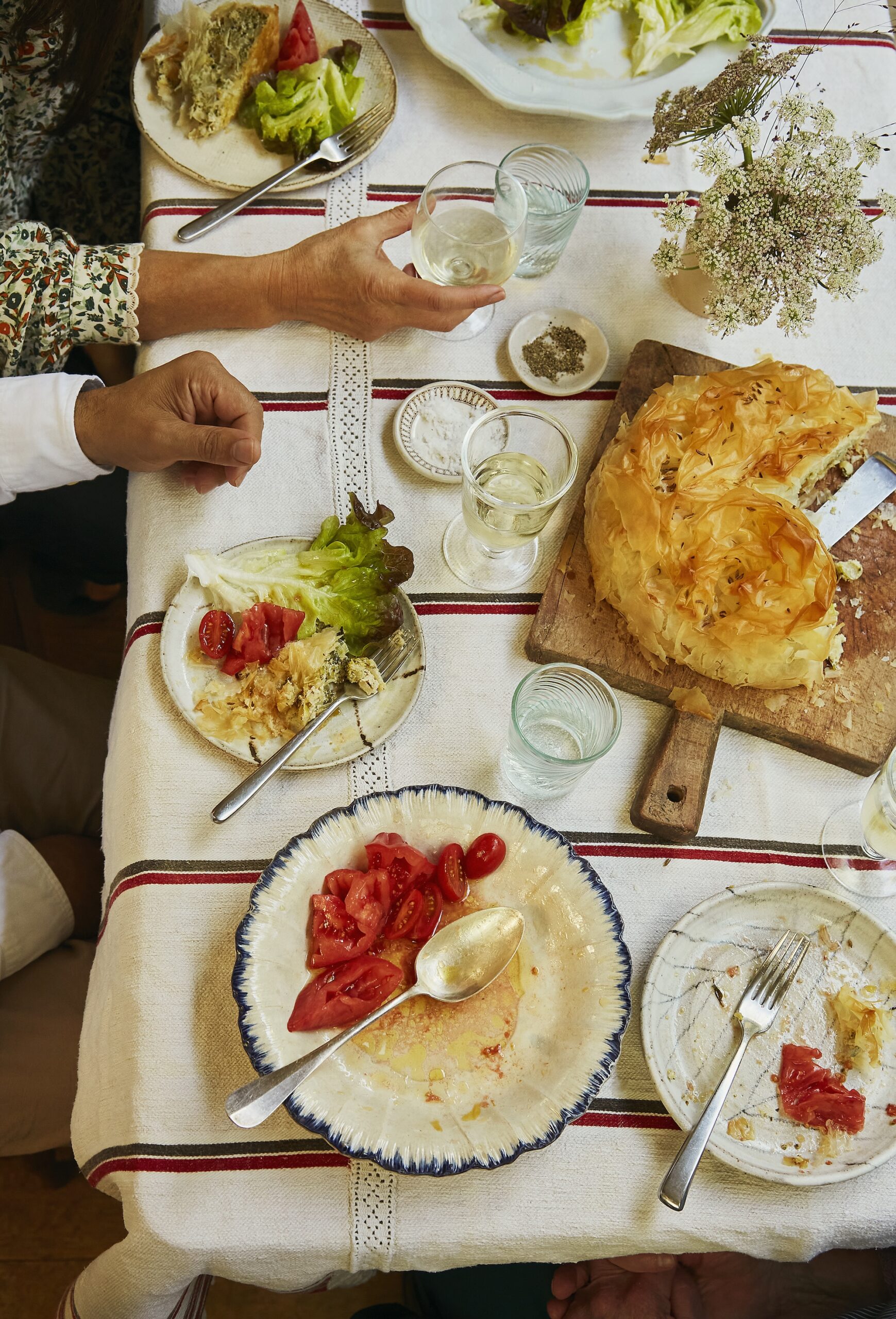 Table spread with assorted food and fresh bread