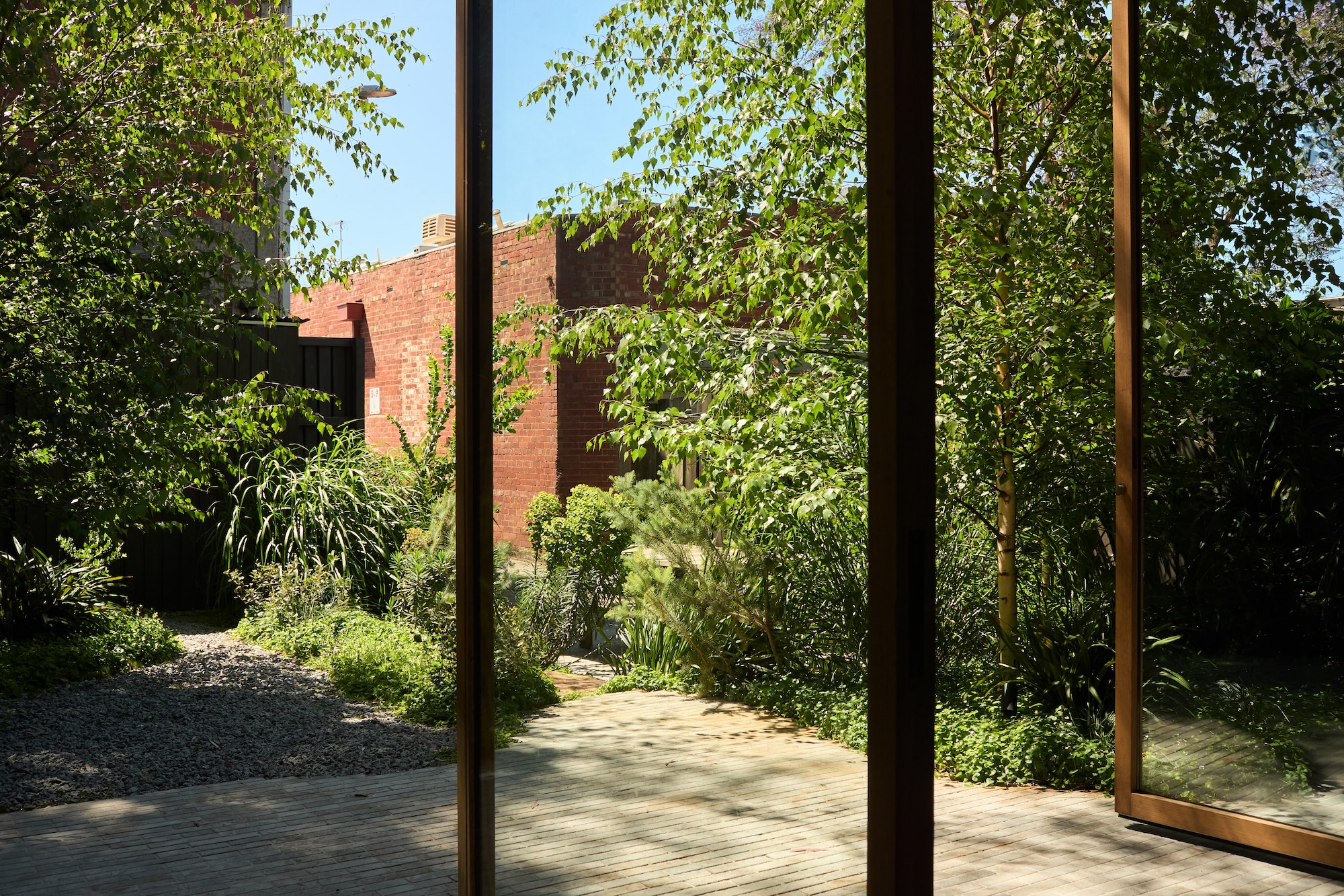 Jala’s structured planting and paved courtyard for relaxed outdoor living.