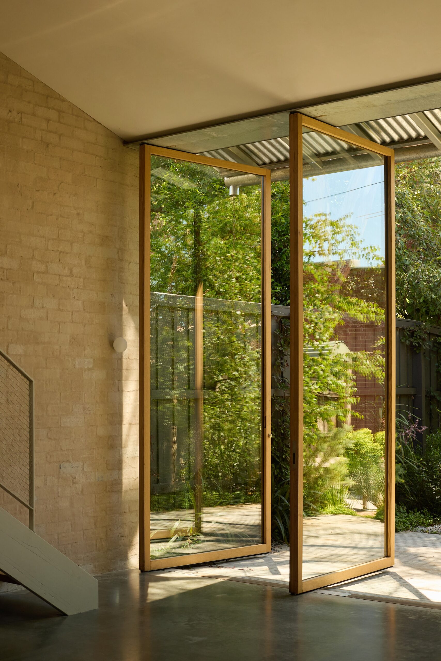 x Sunlit courtyard by Jala enhancing indoor-outdoor flow.