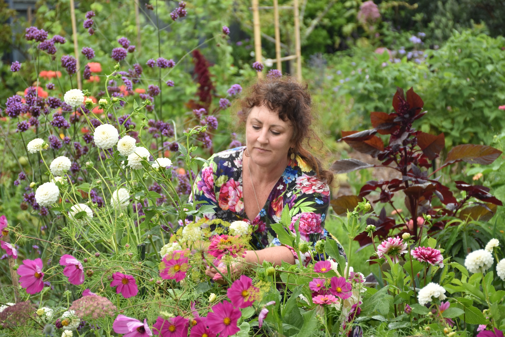Hands-on flower cultivation in the working garden at Paradise Botanica.