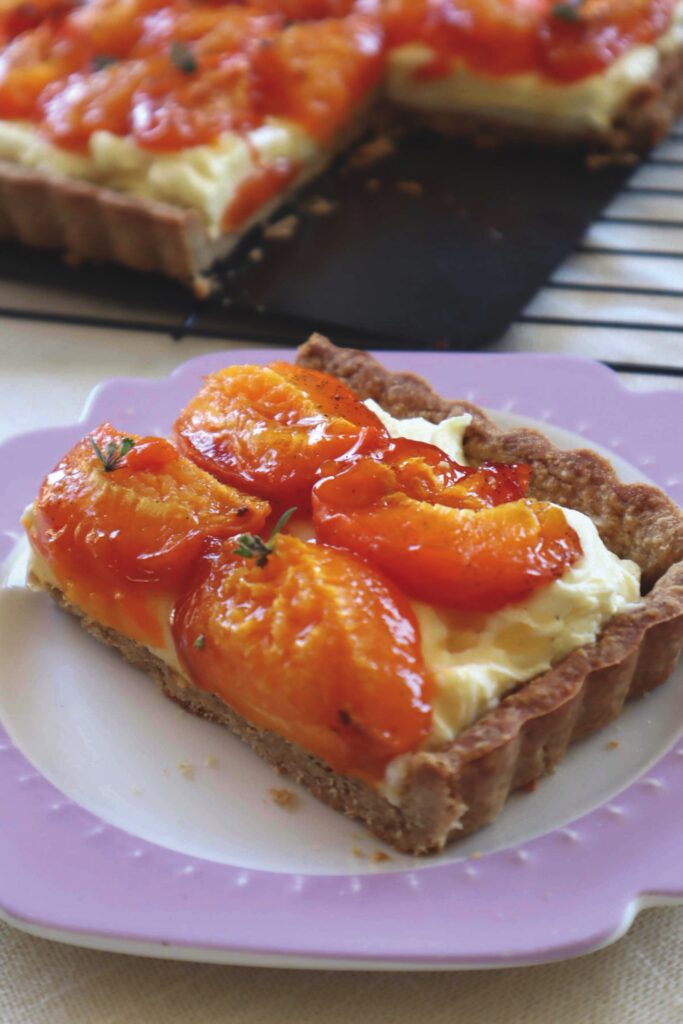 Apricot tart served on purple plate - recipe by Wendy Morgan