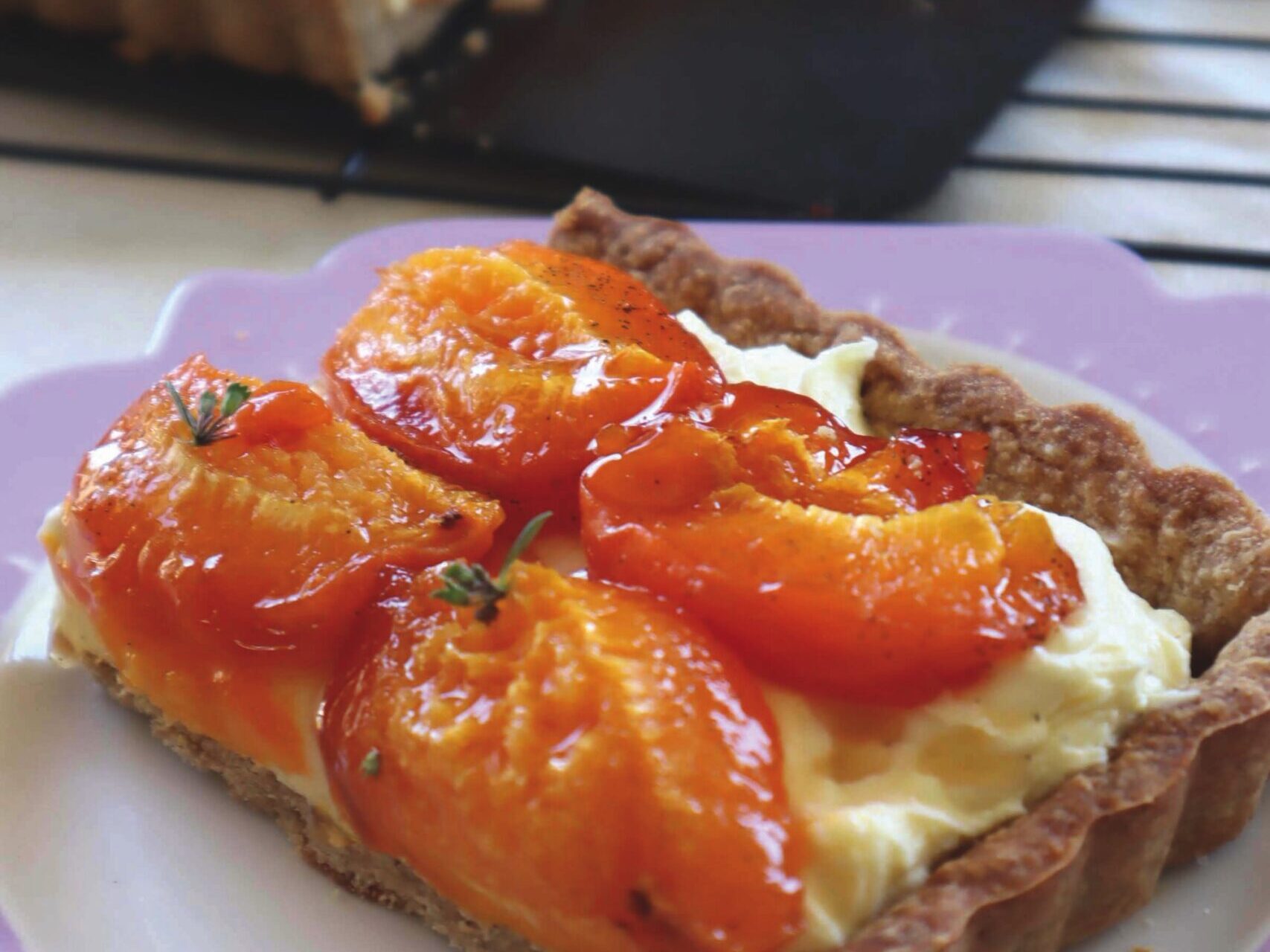 Apricot tart served on purple plate - recipe by Wendy Morgan