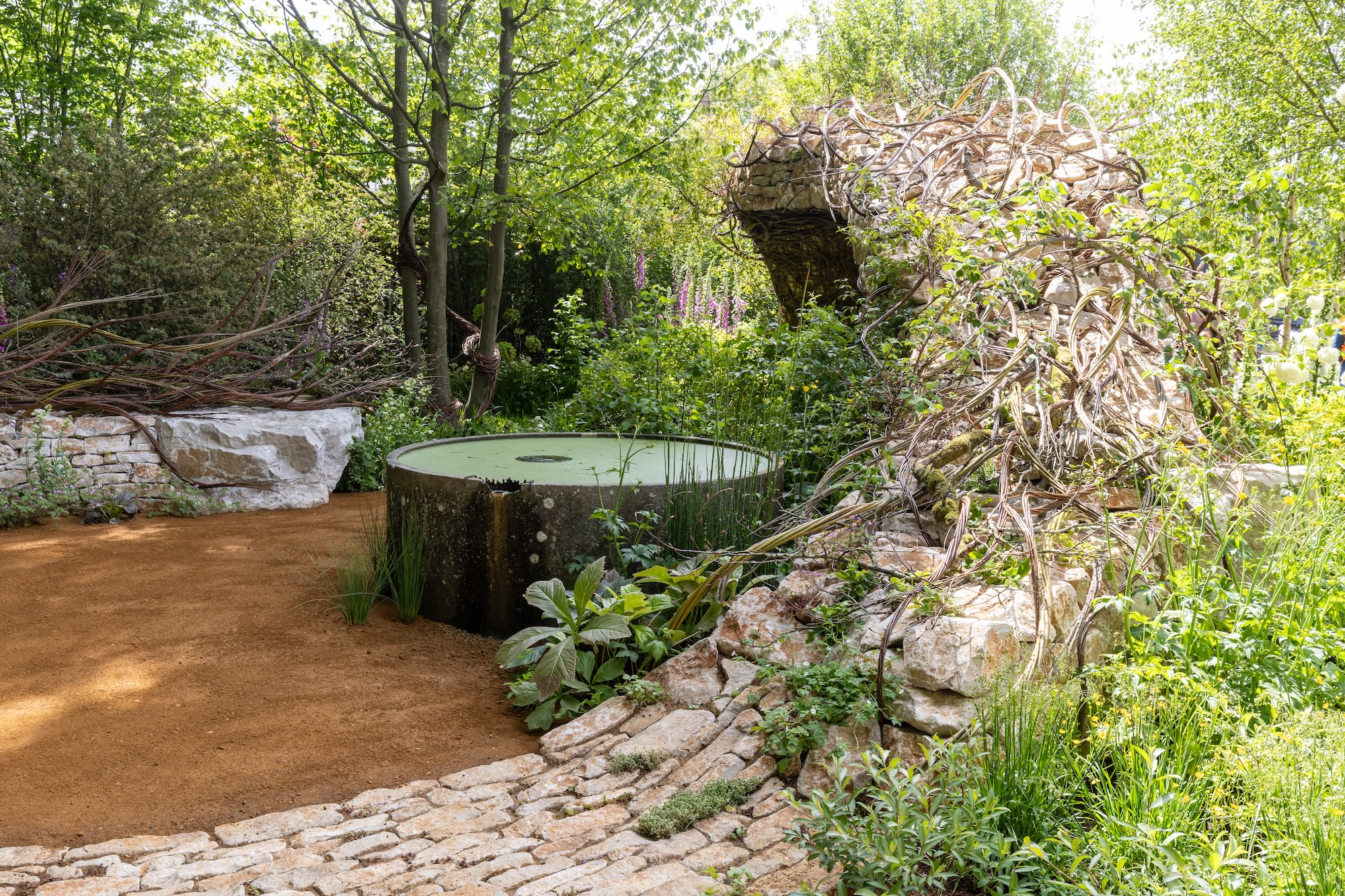 1 Natural stone seating integrated into layered planting at The Campaign to Protect Rural England Garden, RHS CFS.
