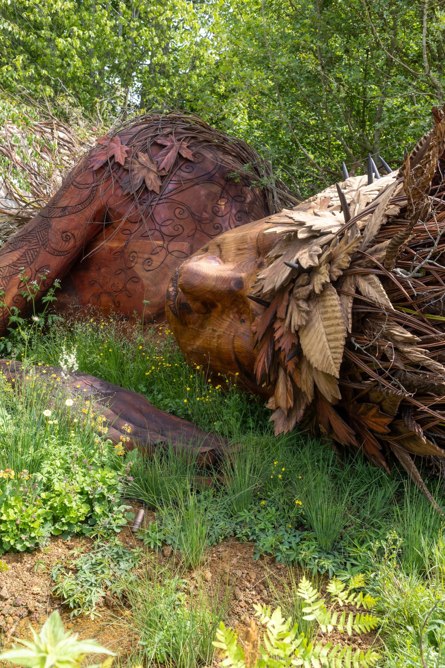 1 Sculptural focal feature emerging from lush planting designed by Sarah Eberle for RHS CFS.