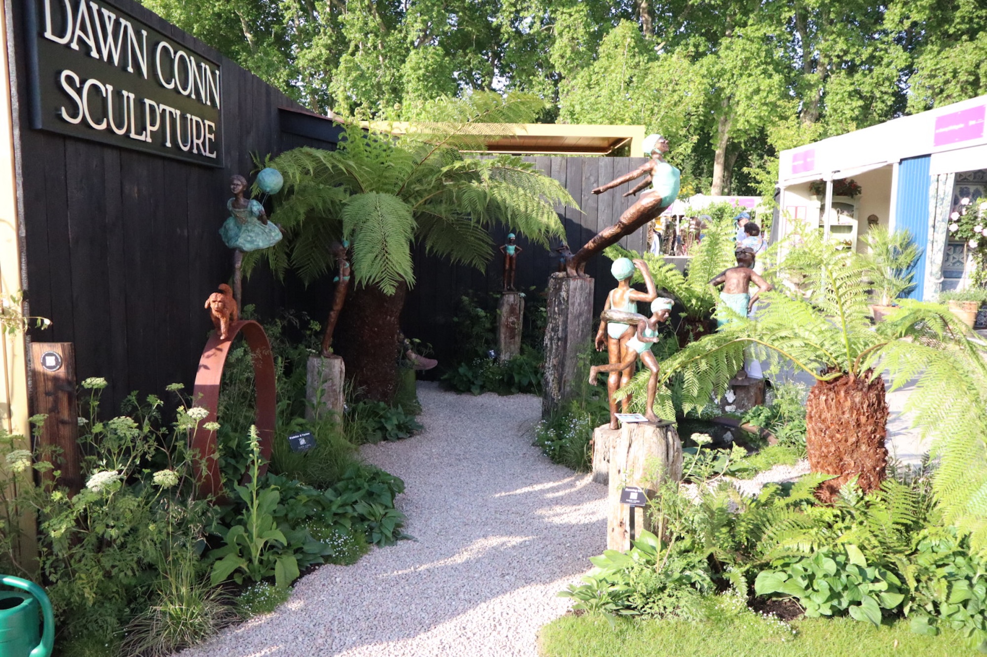A winding pathway leads visitors through Under Southern Skies, where layered planting, sculpture and thoughtful design by Siobhan Keating create an immersive experience at RHS CFS.