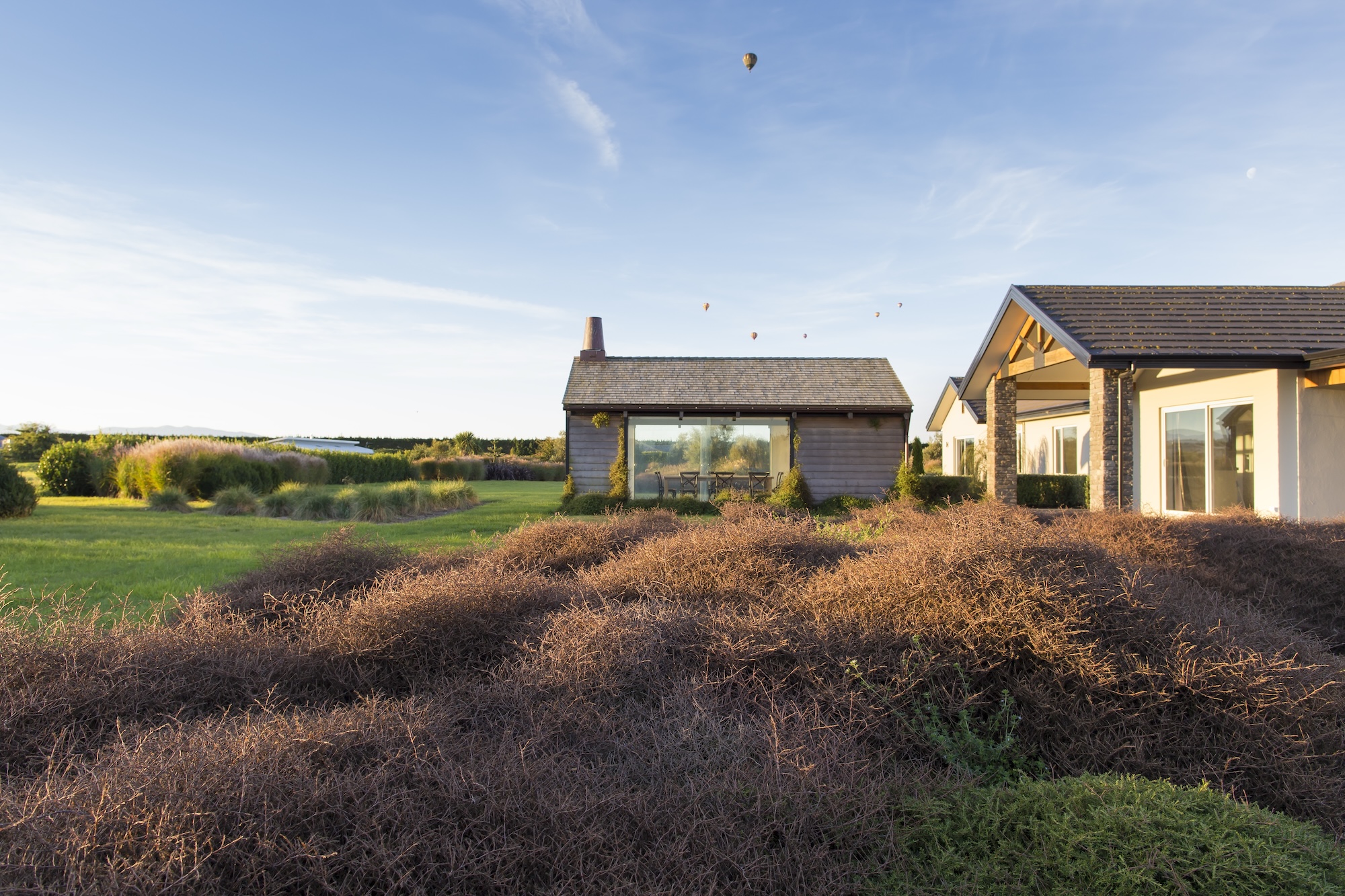 The standalone “cookhouse” is an entertainment area with wonderful garden views in Canterbury garden