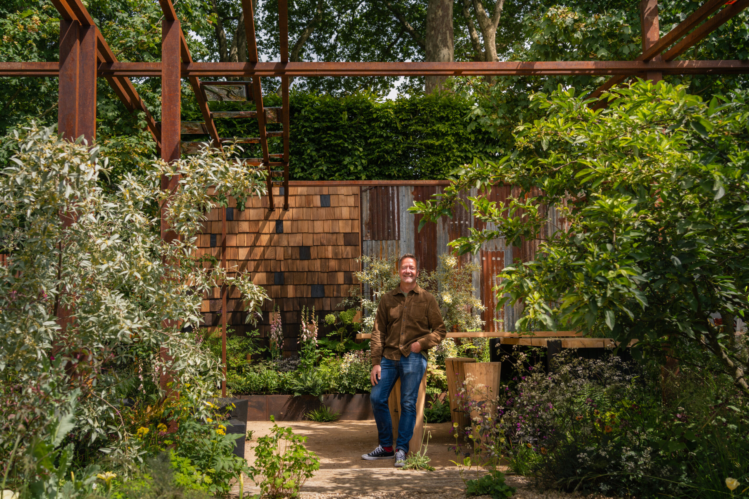 Patrick Clarke - The Children’s Society Garden Patrick Clarke surrounded by naturalistic planting in his RHS CFS The Children's Society Garden.