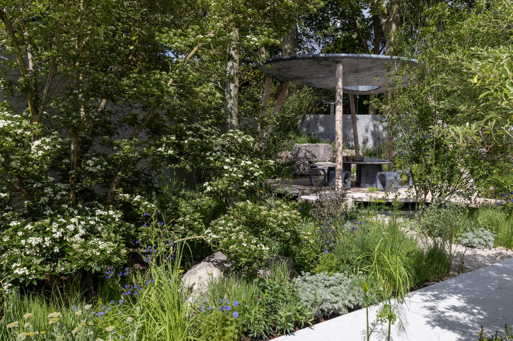 Garden pavilion surrounded by planting in RHS CFS The Eden Project
