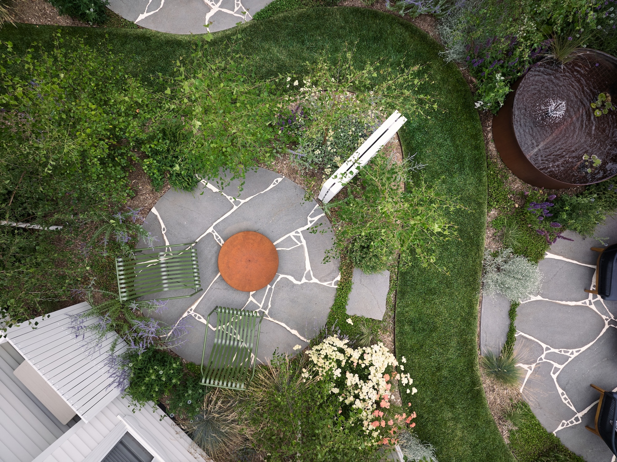 Aerial View of a Trentham Courtyard Overhead view of curved paving and outdoor seating in a Melbourne garden designed by Timeless Outdoors