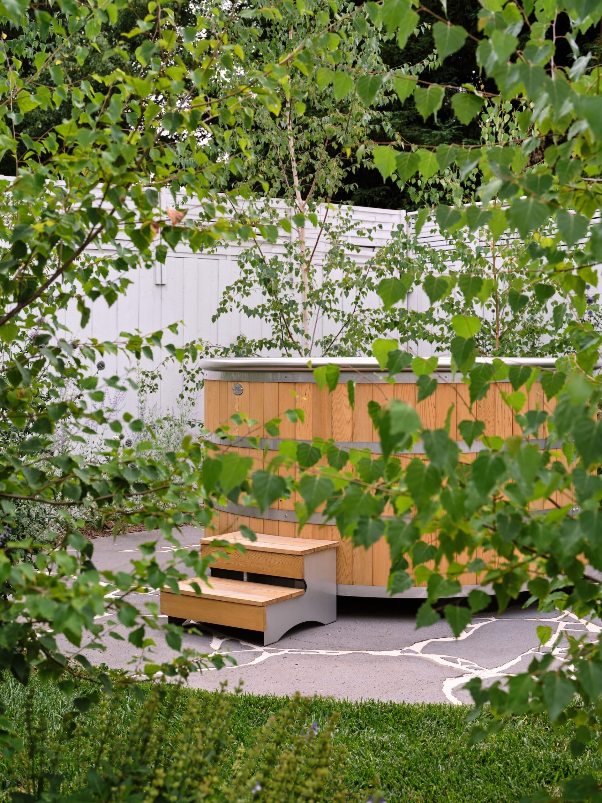 Spa Pool and Garden Planting Outdoor hot tub surrounded by greenery in a Melbourne garden by Timeless Outdoors.